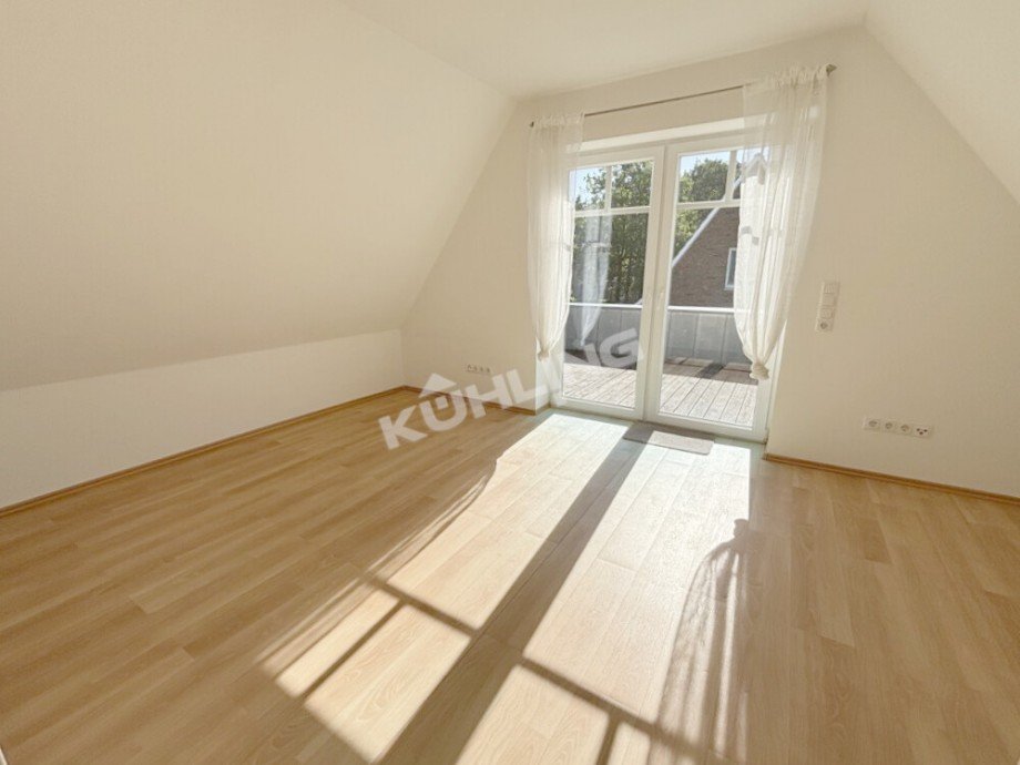 Wohnzimmer mit Zugang zur Dachterasse Etagenwohnung Vechta