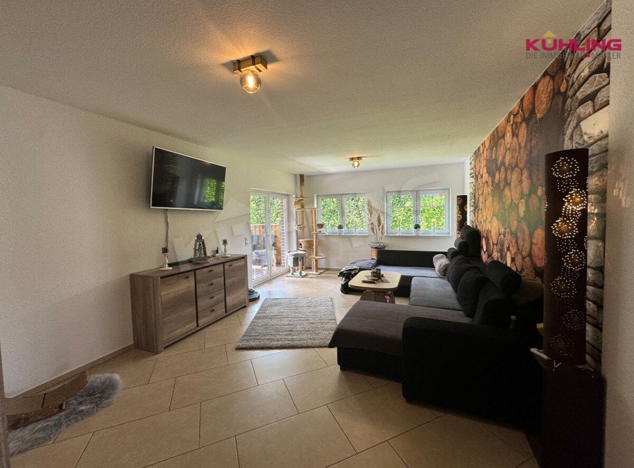 Wohnzimmer mit Zugang zum Terrasse Bungalow Goldenstedt